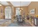 Elegant dining area featuring an ornate light fixture and classic architectural details at 824 Preserve Ter, Lake Mary, FL 32746