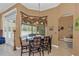 Well-lit dining area with backyard pool views through bay windows, enhancing mealtime ambiance at 824 Preserve Ter, Lake Mary, FL 32746