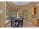 Dining area adjacent to a large bay window, complemented by stylish pendant lighting at 824 Preserve Ter, Lake Mary, FL 32746