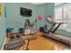 Home gym filled with exercise equipment and a wall-mounted TV, designed for fitness and wellness at 824 Preserve Ter, Lake Mary, FL 32746