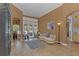 Inviting living room with neutral tones, tile flooring, a plush rug, and elegant french doors to the outdoor patio at 824 Preserve Ter, Lake Mary, FL 32746