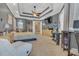 Spacious main bedroom featuring trey ceiling, ceiling fan, and sitting area with natural light at 824 Preserve Ter, Lake Mary, FL 32746