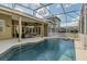 A screened-in pool offers a refreshing escape with an outdoor living space perfect for relaxation and entertaining at 824 Preserve Ter, Lake Mary, FL 32746