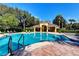 Stunning community pool with sparkling water, comfortable lounge chairs, and a covered pavilion at 8443 Via Bella Notte, Orlando, FL 32836