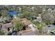 Aerial view of the home, showcasing the lawn, driveway and surrounding neighborhood at 8851 Hillsdale Dr, Orlando, FL 32818