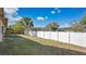 The backyard features a well maintained lawn and a fenced perimeter at 8851 Hillsdale Dr, Orlando, FL 32818