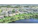 Aerial view of home and the community with pond views at 9014 Sonoma Coast Dr, Winter Garden, FL 34787