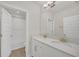 Elegant bathroom featuring a double sink vanity with light countertops, modern fixtures, and a tiled shower and tub combo at 9014 Sonoma Coast Dr, Winter Garden, FL 34787