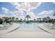 Resort-style community pool with lounge chairs and lush landscaping at 9014 Sonoma Coast Dr, Winter Garden, FL 34787