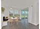 Bright dining area featuring a round table, bench seating, and a sliding glass door at 9014 Sonoma Coast Dr, Winter Garden, FL 34787