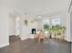 Well-lit dining area with plants, windows, and access to the back patio at 9014 Sonoma Coast Dr, Winter Garden, FL 34787