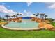 Community entrance featuring a rock waterfall and 'WATERLEIGH' signage at 9014 Sonoma Coast Dr, Winter Garden, FL 34787