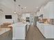 Bright kitchen featuring white cabinets, a large center island with seating, and stainless steel appliances at 9014 Sonoma Coast Dr, Winter Garden, FL 34787