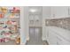 Walk-in pantry with wire shelving and easy access to the kitchen at 9014 Sonoma Coast Dr, Winter Garden, FL 34787