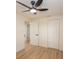 Bedroom featuring wood floors, modern ceiling fan, closet, and neutral paint at 913 Lake Ave, Edgewater, FL 32132