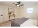 Bedroom with a comfy bed, ceiling fan, and modern decor, creating a relaxing atmosphere at 913 Lake Ave, Edgewater, FL 32132