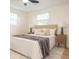 Inviting bedroom with a comfortable bed, neutral tones, and natural light at 913 Lake Ave, Edgewater, FL 32132