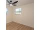 Bright bedroom featuring wood floors, modern ceiling fan and neutral paint at 913 Lake Ave, Edgewater, FL 32132