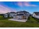 View of the backyard featuring a large brick patio, perfect for outdoor entertaining at 9752 Petition Way, Orlando, FL 32832