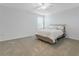 This bedroom features neutral colors, a ceiling fan, and carpeted floors at 9752 Petition Way, Orlando, FL 32832