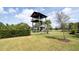 Community observation tower with palm tree accents and manicured landscape at 9752 Petition Way, Orlando, FL 32832