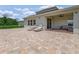 Paver patio featuring lounge chairs and an outdoor seating area adjacent to the home at 9752 Petition Way, Orlando, FL 32832