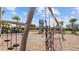 Community playground with swings, benches, and various climbing options; all in a fenced-in play area at 9752 Petition Way, Orlando, FL 32832