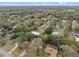 Aerial view showcasing a home nestled among trees, with additional buildings, offering a secluded living environment at 1134 Glenwood Rd, Deland, FL 32720
