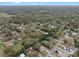 Aerial view of a quiet neighborhood showcasing lush green trees and well-maintained homes at 1134 Glenwood Rd, Deland, FL 32720