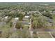 Aerial view highlighting a home and property defined by its boundaries, along a road, with another large outbuilding at 1134 Glenwood Rd, Deland, FL 32720