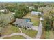 Aerial view of home featuring lush greenery and a generous lot size at 1134 Glenwood Rd, Deland, FL 32720