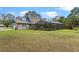 Lovely brick home with a screened-in pool offering a private backyard oasis at 1134 Glenwood Rd, Deland, FL 32720