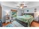 Charming bedroom with a large window and a ceiling fan at 1134 Glenwood Rd, Deland, FL 32720