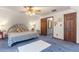 Bright bedroom featuring vaulted ceilings, neutral walls, and plush carpeting at 1134 Glenwood Rd, Deland, FL 32720