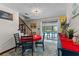 Cozy dining area with seating for four, offering views of the inviting outdoor pool and patio area at 1134 Glenwood Rd, Deland, FL 32720