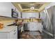Well-equipped kitchen with white cabinets, stainless steel appliances, and a decorative backsplash at 1134 Glenwood Rd, Deland, FL 32720