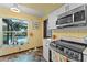 Bright kitchen with a view of the backyard pool, modern appliances, and stylish finishes at 1134 Glenwood Rd, Deland, FL 32720