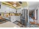 Spacious kitchen featuring stainless steel appliances, white cabinets, and open access to other living areas at 1134 Glenwood Rd, Deland, FL 32720