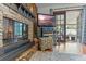 Inviting living room features a stone fireplace and sliding glass doors to the lanai at 1134 Glenwood Rd, Deland, FL 32720