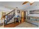 Functional living space with a cozy seating area, desk nook, and easy access to a nearby bathroom at 1134 Glenwood Rd, Deland, FL 32720