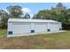 A large metal building provides ample storage with three bays, complemented by a clean concrete base at 1134 Glenwood Rd, Deland, FL 32720