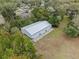 Spacious three-bay metal storage building with concrete apron, perfect for equipment storage at 1134 Glenwood Rd, Deland, FL 32720