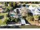 Aerial view showcasing the home's backyard pool and boat dock on the waterfront at 124 Godfrey Rd, Edgewater, FL 32141