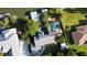 Aerial view featuring a pool, backyard, landscaping, boat dock, and solar panels at 124 Godfrey Rd, Edgewater, FL 32141