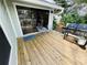 Relaxing back deck featuring outdoor seating and grill for backyard enjoyment and entertaining at 124 Godfrey Rd, Edgewater, FL 32141