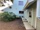 View of the backyard featuring a shed, trees, and well-maintained lawn at 124 Godfrey Rd, Edgewater, FL 32141