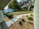 Landscaped backyard featuring paver walkway with a shed and vintage trailer at 124 Godfrey Rd, Edgewater, FL 32141