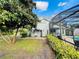 Charming backyard featuring lush greenery, a convenient outdoor bar, and serene views of the surrounding landscape at 124 Godfrey Rd, Edgewater, FL 32141