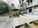 Backyard patio with spiral staircase, upper deck, landscaping and mature trees, a private outdoor retreat at 124 Godfrey Rd, Edgewater, FL 32141