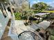 Scenic backyard featuring a boat dock, lush greenery, and a tranquil outdoor setting, accessible from the home's deck at 124 Godfrey Rd, Edgewater, FL 32141
